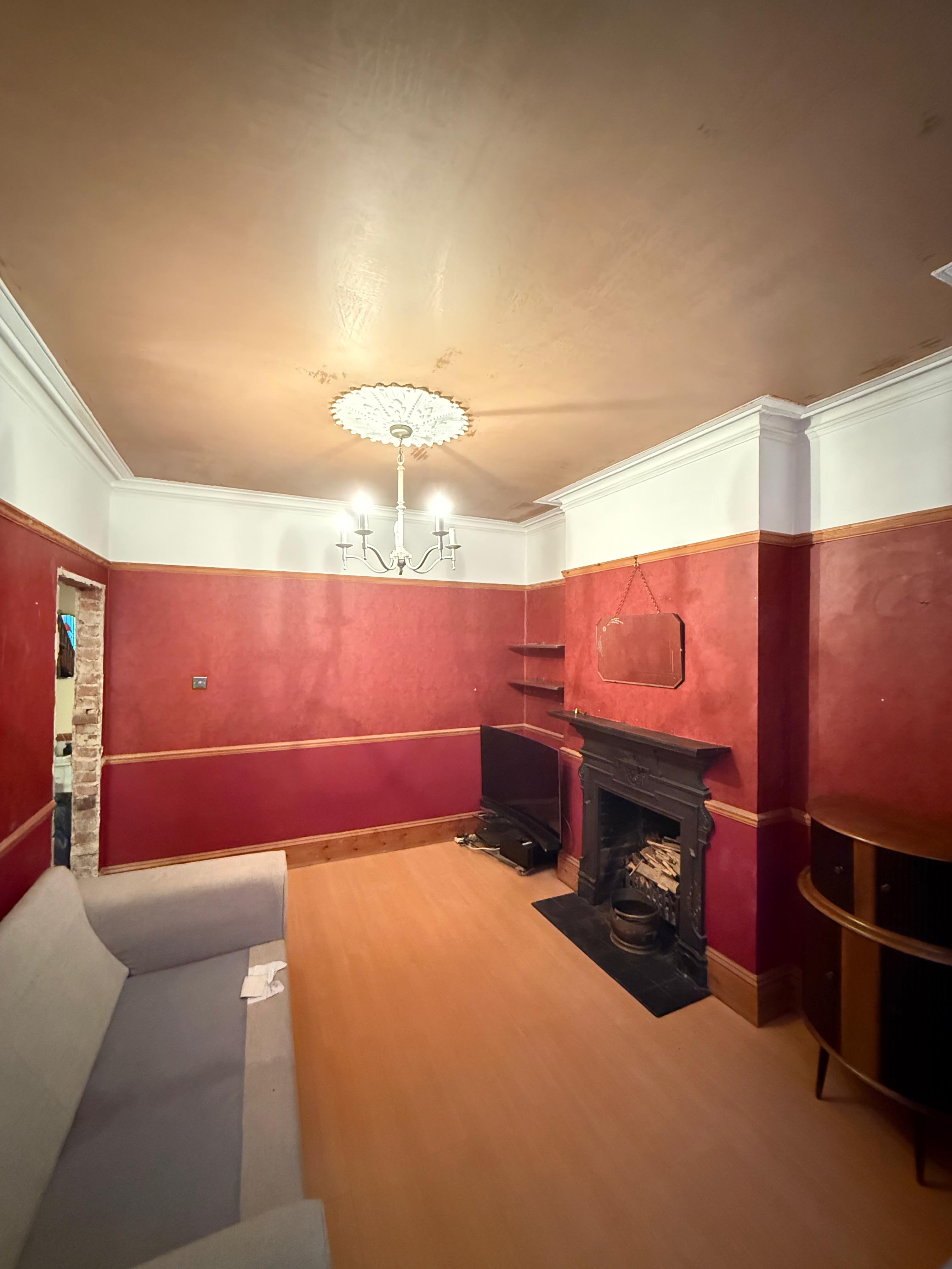Plastered room with coving and ceiling rose — period property