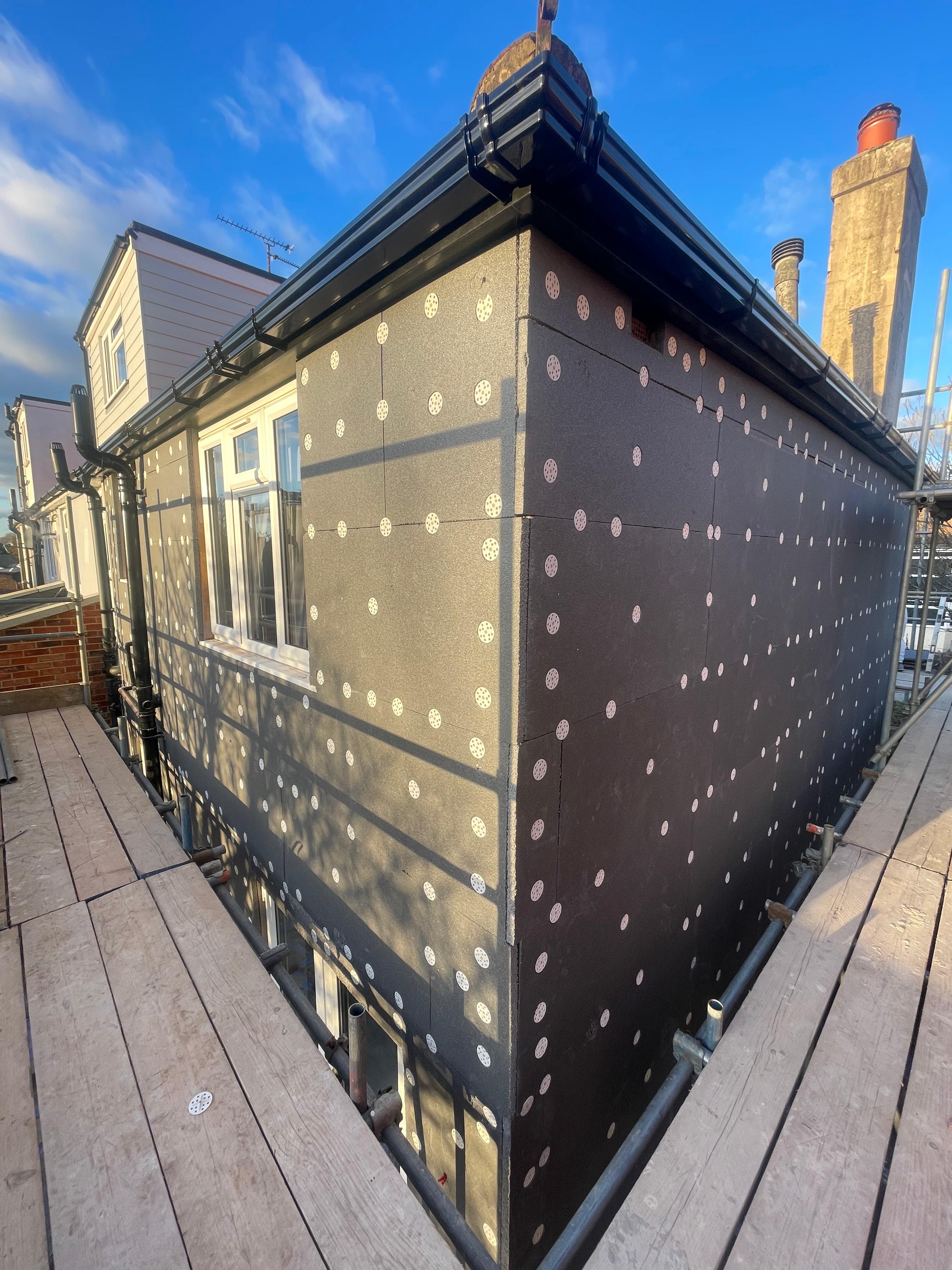 EWI corner wrap installation — full building wrap